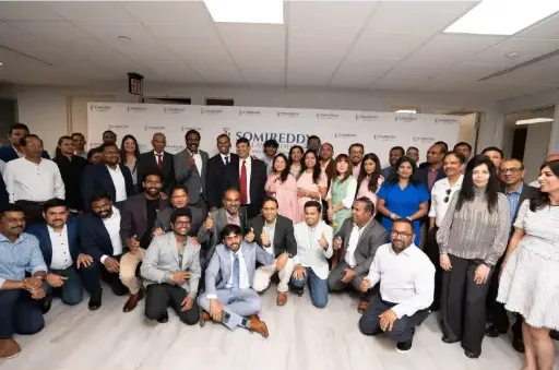Somireddy Law Group team photo featuring Santosh Somireddy, Vijay Yellareddigari, Anudeep Illindala, and legal staff.