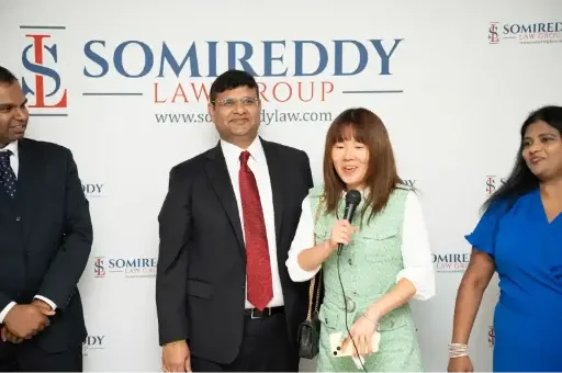 Somireddy Law Group founder Santosh Somireddy and Vijay Yellareddigari with Sangeetha Mugunthan at a firm event.